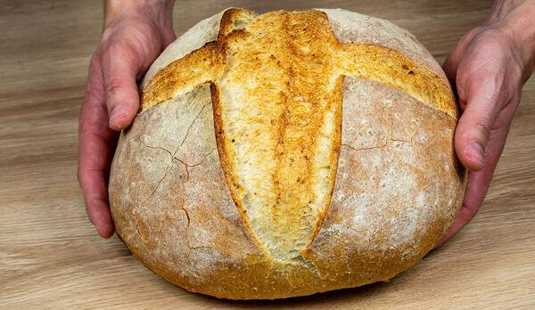 Hand-scored artisan bread with golden crust